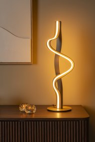 Lambada 60cm Sekt Von Lucide - Lambada ist eine elegante Tischleuchte aus Metall mit exklusiver champagnerfarbener Oberfl&auml;che und einer weichen, organischen Form, die sofort ins Auge f&auml;llt.