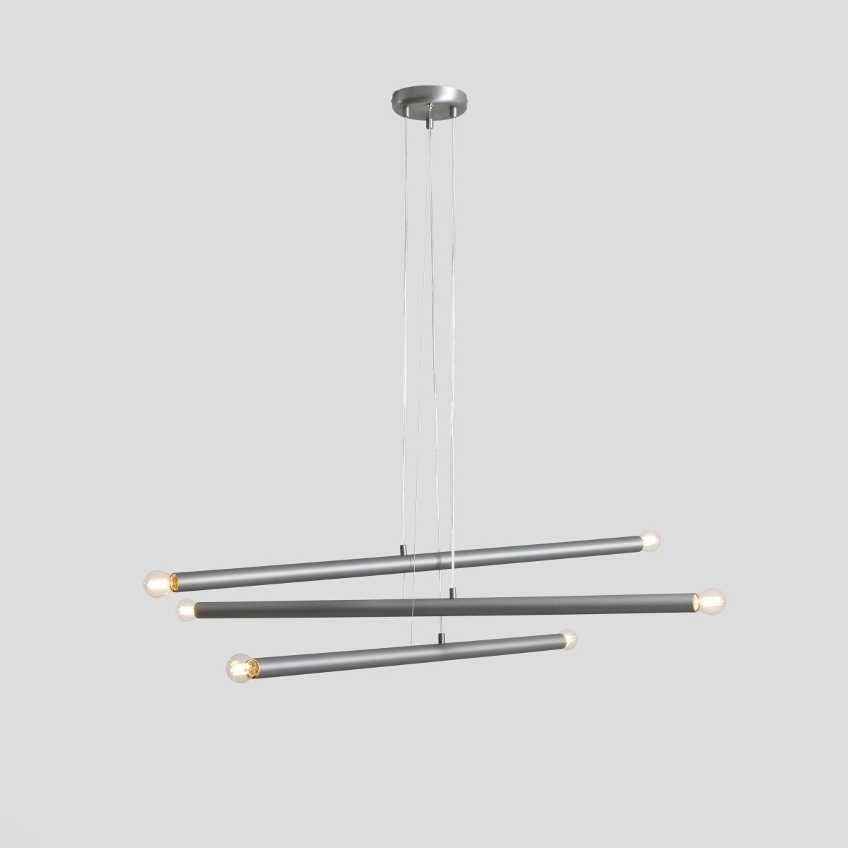Tubo 6 100cm Stahl hängelampe Von Artera - Die Leuchte besteht aus drei schmalen Metallrohren in elegantem Stahl-Finish, die in unterschiedlichen H&ouml;hen und Winkeln angeordnet sind und so eine dynamische und luftige Optik erzeugen.