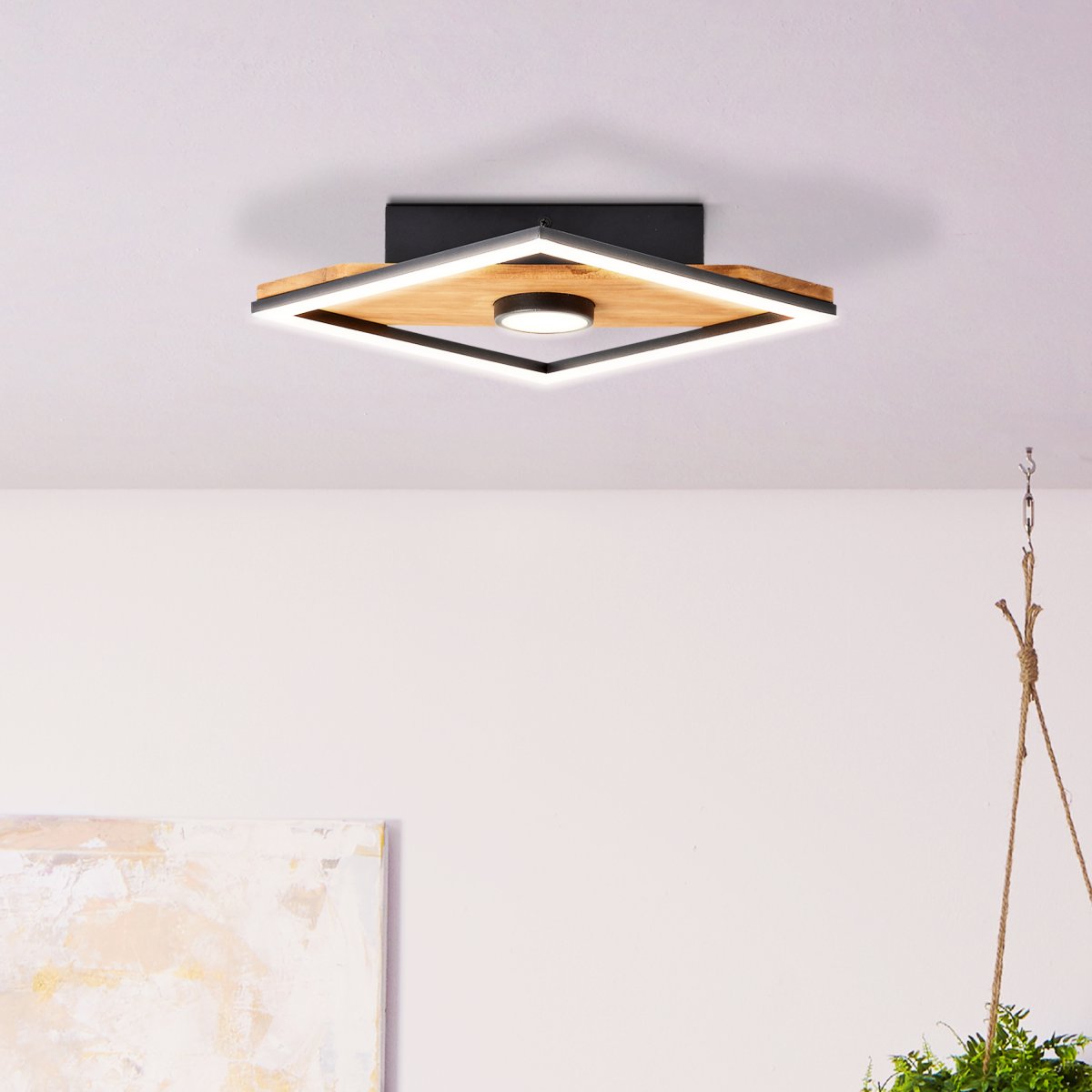 Woodbridge 25cm Holz deckenleuchte Von Brilliant - Die Lampe kombiniert mattschwarzes Metall mit Holzdetails und schafft so eine wohnliche und nat&uuml;rliche Atmosph&auml;re.