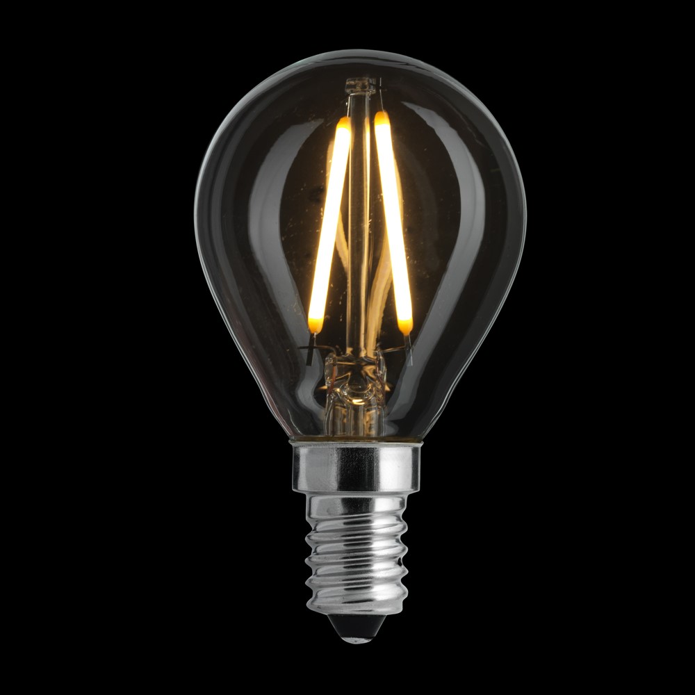 LED E14 Kugellampe 2W 2700K Transparent Von Unison - Mit nur 2 W Leistung und einem weichen, warmen Licht von 2700 K ist es sowohl energieeffizient als auch perfekt geeignet, um in kleineren Lampen oder dekorativen Installationen eine angenehme Atmosph&auml;re zu schaffen.