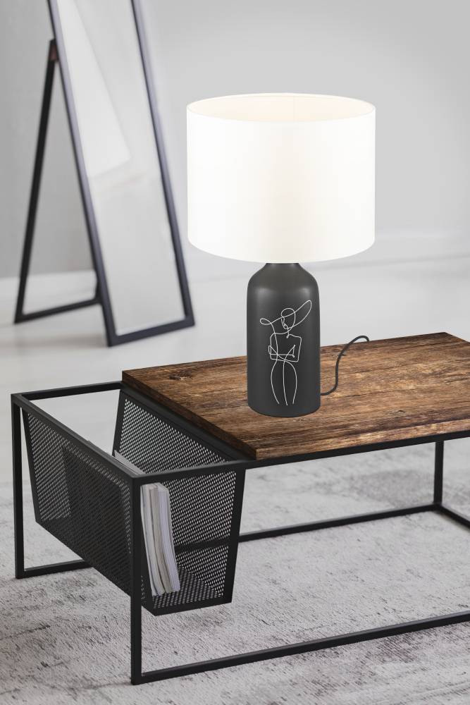 Vinoza 53cm Schwarz tischlampe Von Eglo - Mit einem schwarzen Sockel, der mit minimalistischen Linien verziert ist, die eine Frau mit Hut darstellen, verleiht die Lampe Ihrem Zuhause eine anspruchsvolle und künstlerische Note.