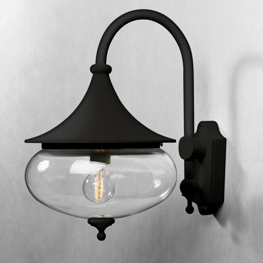 Libra Schwarz außenlampe Von Konstsmide - Die weichen Formen und der große Schirm aus klarem Glas verbreiten ein warmes und angenehmes Licht und schaffen so eine einladende Atmosphäre in Eingängen oder auf Terrassen.