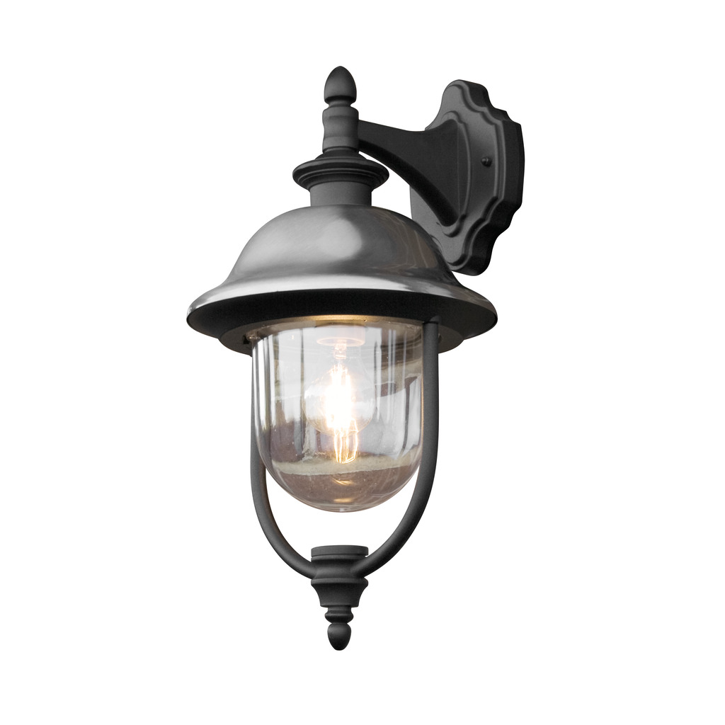Parma Schwarz außenlampe Von Konstsmide - Mit seiner robusten schwarzen Oberfläche und dem klaren Glasschirm verbreitet es ein warmes und einladendes Licht und schafft so eine einladende Atmosphäre am Eingang oder auf der Terrasse.