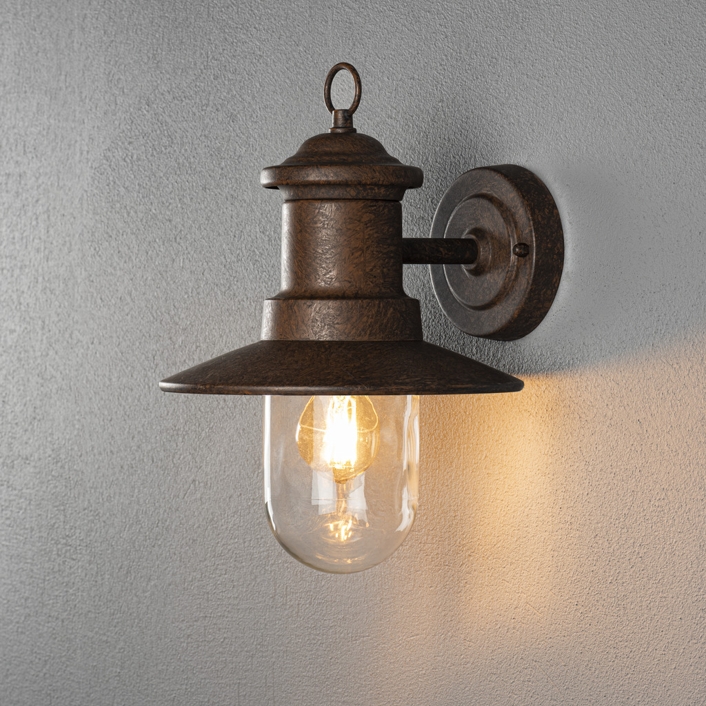 Napoli Rost außenlampe Von Konstsmide - Das klassische Design der Lampe mit runder Glaskuppel und breitem Schirm verbreitet ein warmes und angenehmes Licht, perfekt für die Beleuchtung von Eingängen und Terrassen.