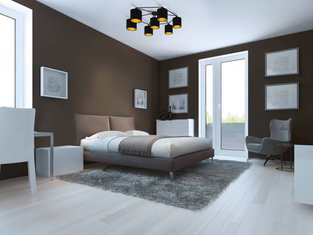 Staiti 84cm Schwarz deckenleuchte Von Eglo - Das moderne Design kombiniert sieben schwarze Lampenschirme mit goldfarbener Innenseite und erzeugt so ein warmes und einladendes Licht.