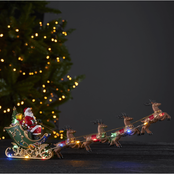 Deerville Mehrfarbig Von Star Trading - Dekofigur in Form des Weihnachtsmanns mit Schlitten und Rentieren.