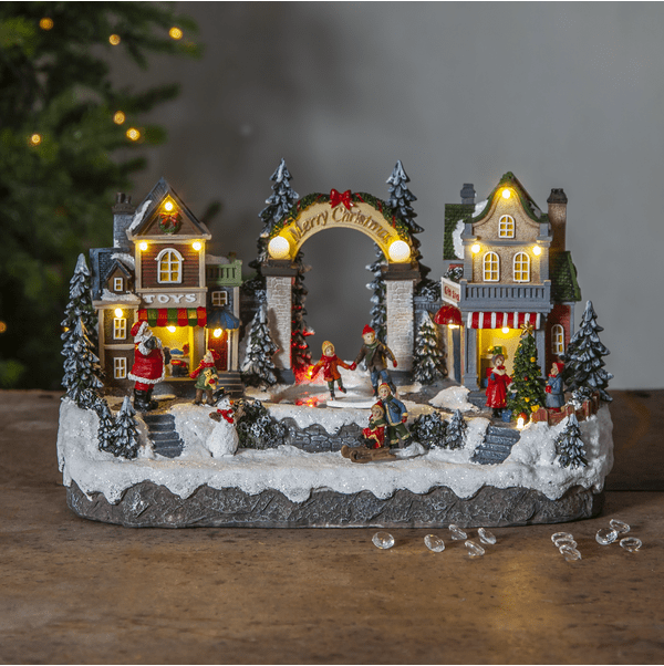 Iceville 20cm Mehrfarbig Von Star Trading - Detailliertes Dekorationsdorf mit schlittschuhlaufenden Kindern, die sich drehen.
