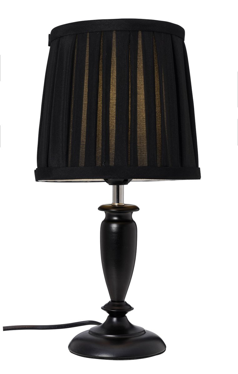 Ines 34cm Schwarz tischlampe Von Cottex - Der schöne Metallsockel in Kombination mit dem plissierten Textilschirm schafft eine warme und einladende Atmosphäre.