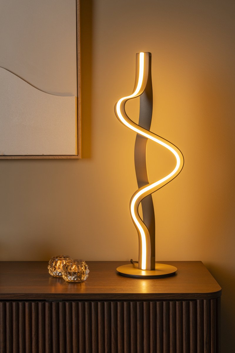 Lambada 60cm Sekt tischlampe Von Lucide - Lambada ist eine elegante Tischleuchte aus Metall mit exklusiver champagnerfarbener Oberfl&auml;che und einer weichen, organischen Form, die sofort ins Auge f&auml;llt.
